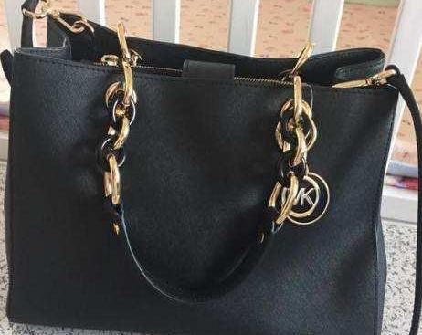 mk经典款包包是什么皮,mk贝壳包包官网价格