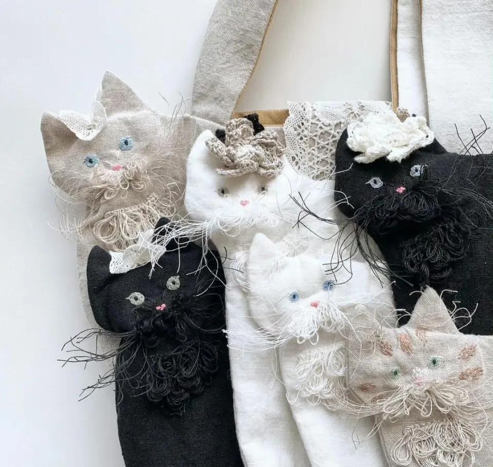 猫咪刺绣帆布包,猫咪揣手款包