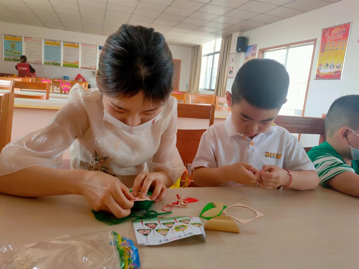 全市组织开展端午节文明实践活动,社区粽叶飘香品味端午活动主题