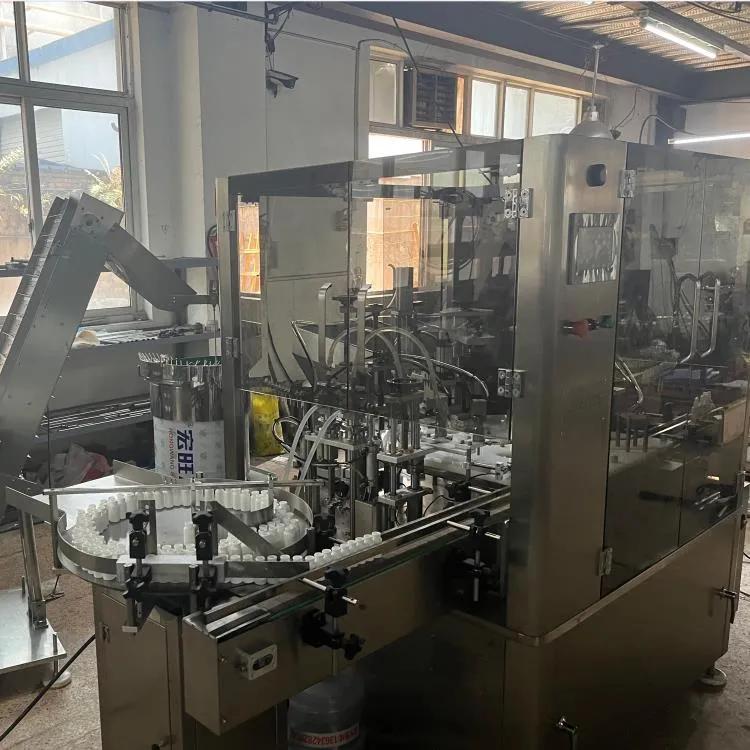 ZHY-50C全自动药品液体*剂喷**灌装机旋盖机