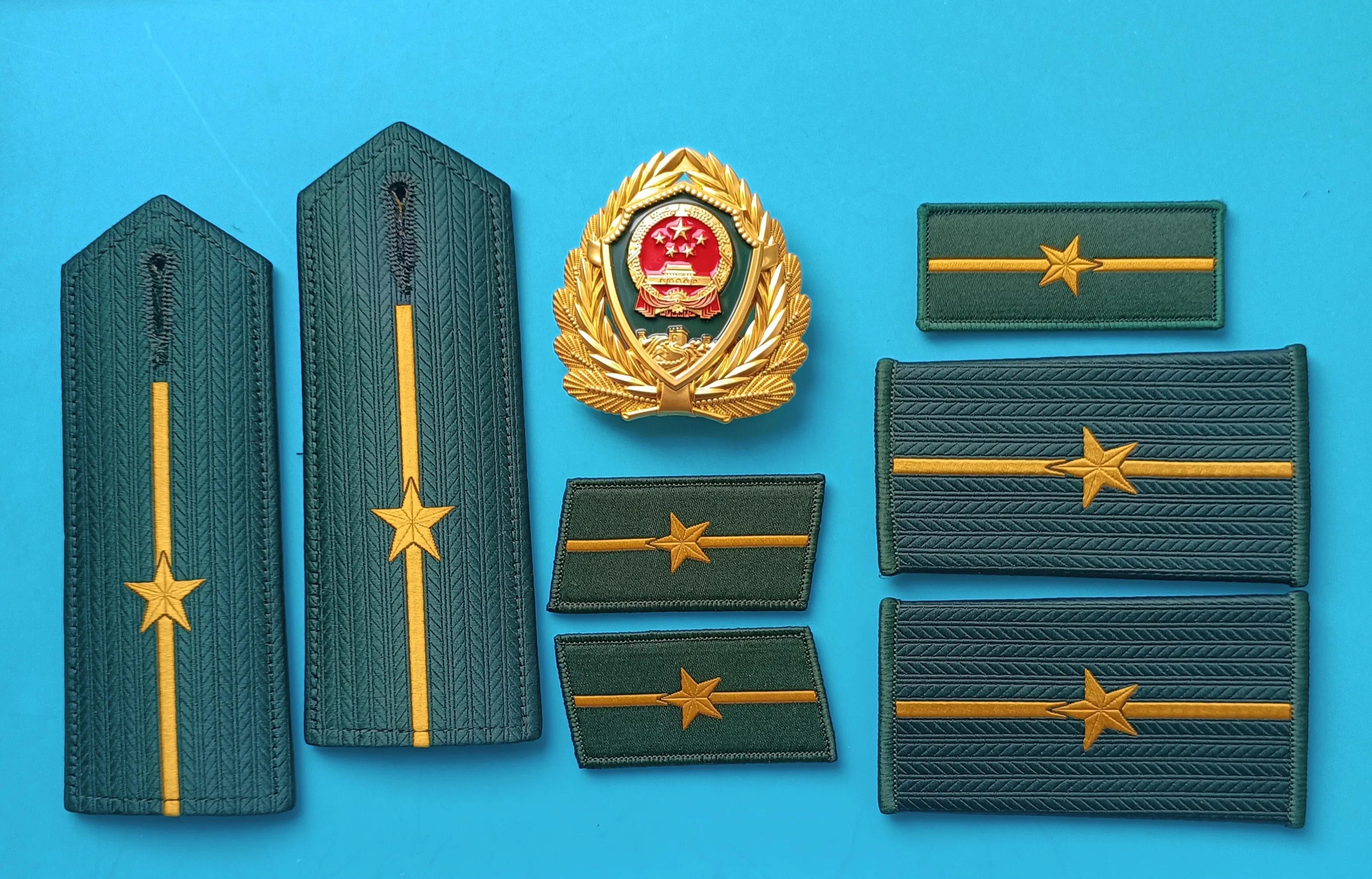 毛启国军装,毛启国警用帽徽